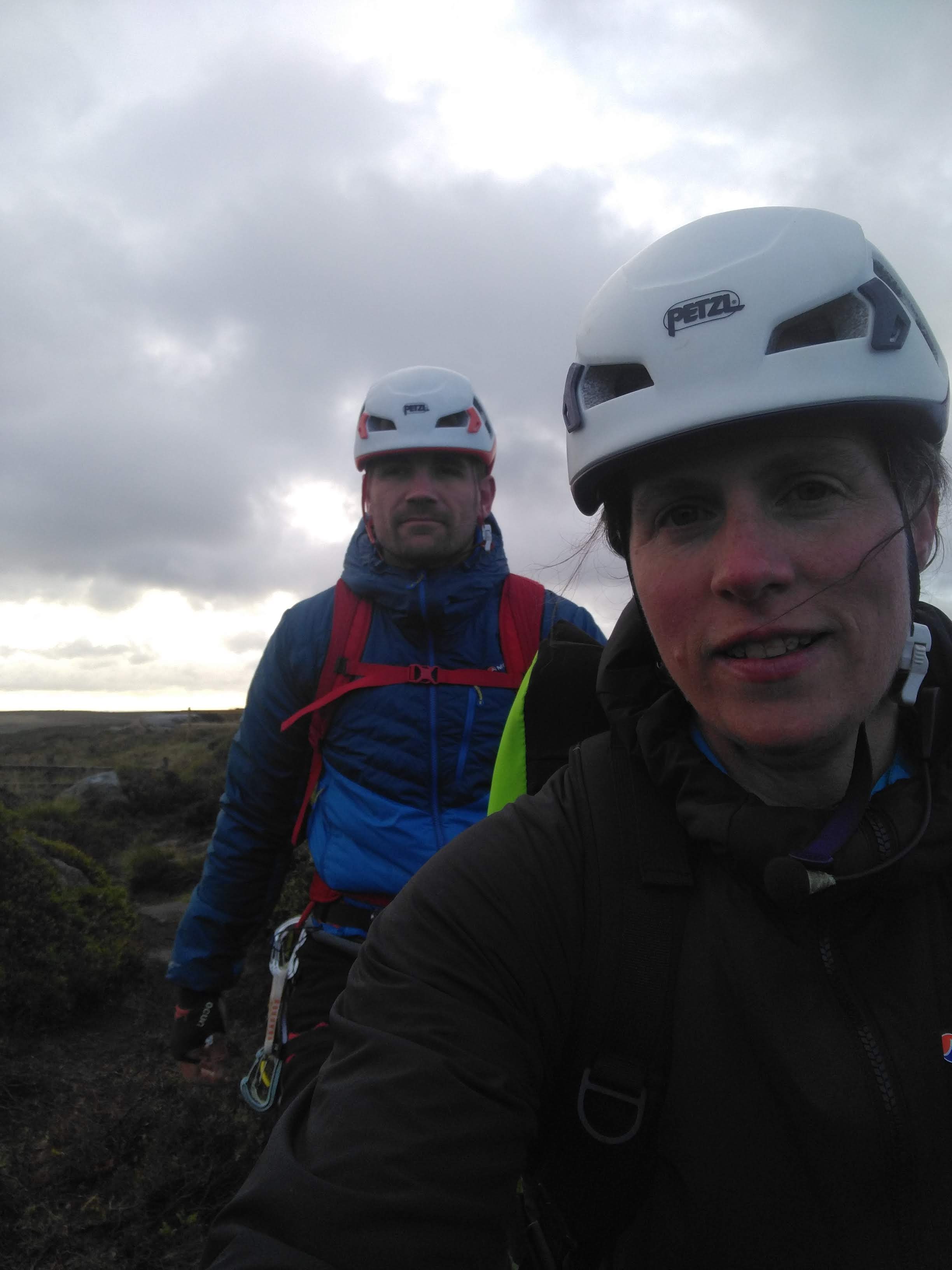 Picture of Molly and Jesse walking to the first crag at first light.