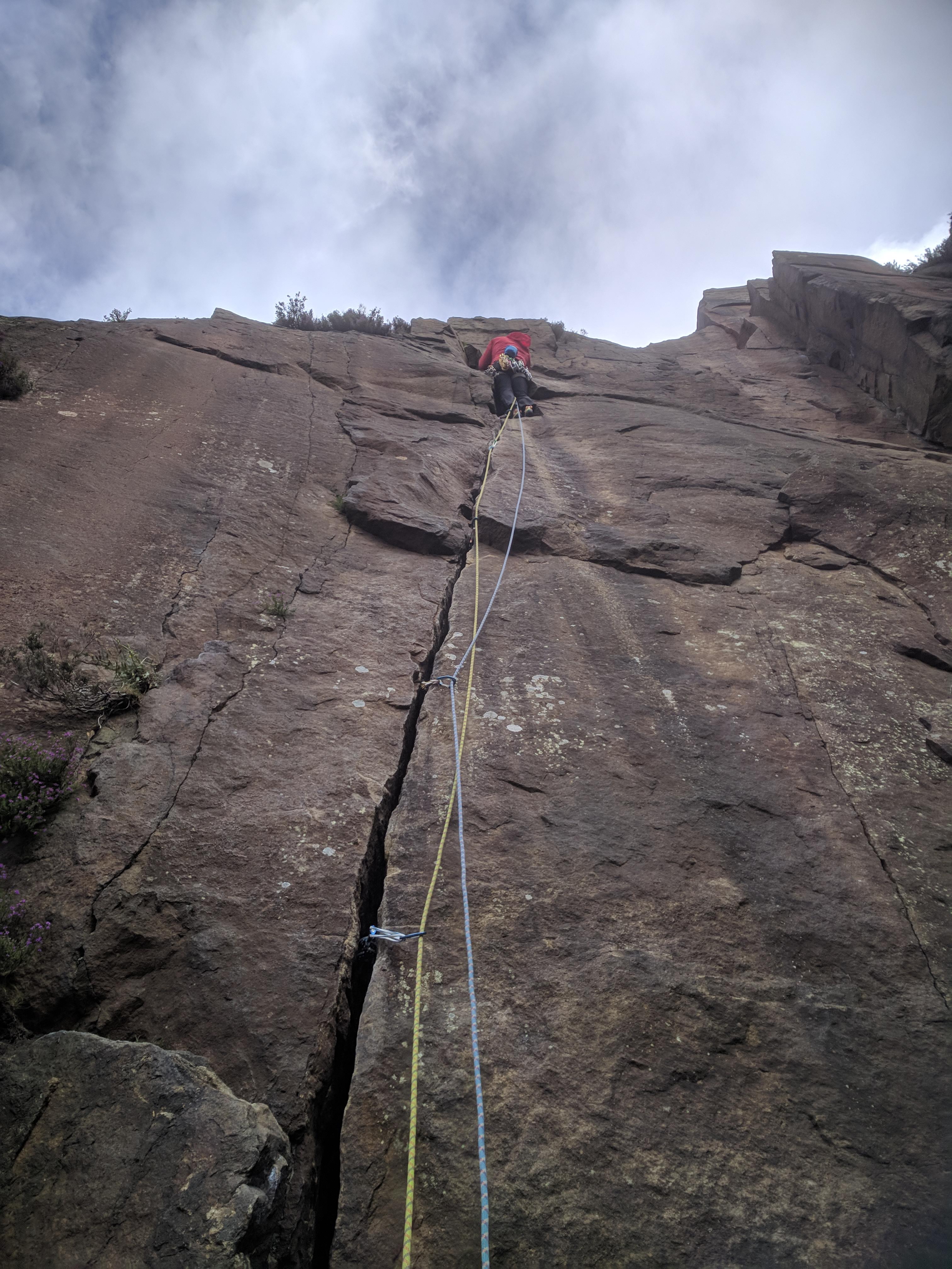 A picture of Jesse high up on the rock face at Millstone