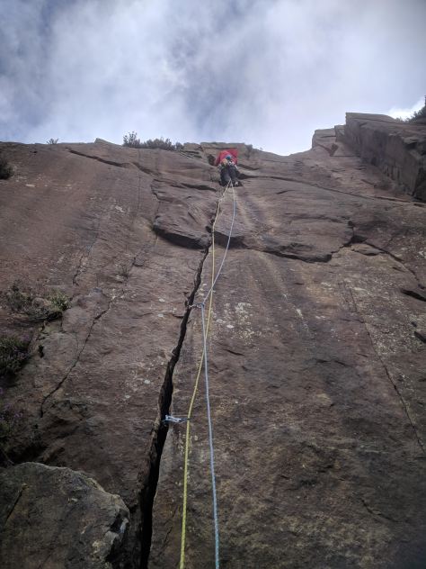 A picture of Jesse high up on the rock face at Millstone