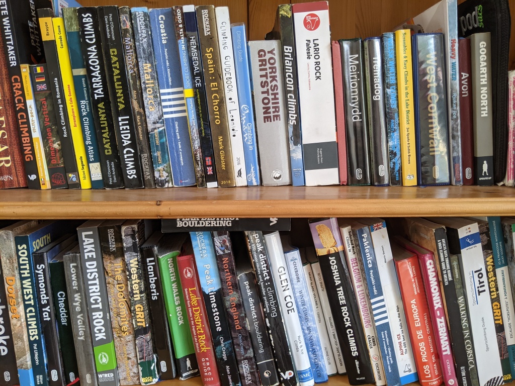 A photo of Molly and Jesse's book shelf which has many many climbing guide books on. For climbing all over the world including Romania, Spain, Italy, Norway, Oman, Malta, USA...the list goes on.