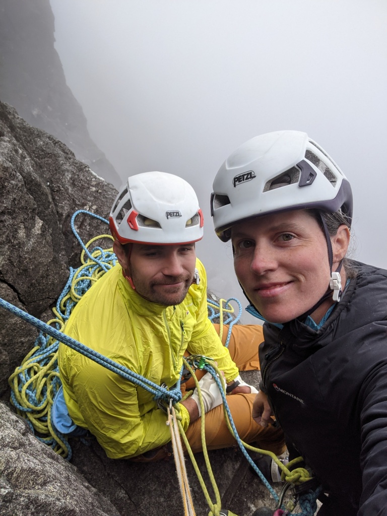 A photo of Molly and Jesse on the first belay ledge on Vulcan Wall, in the clouds a few days later.