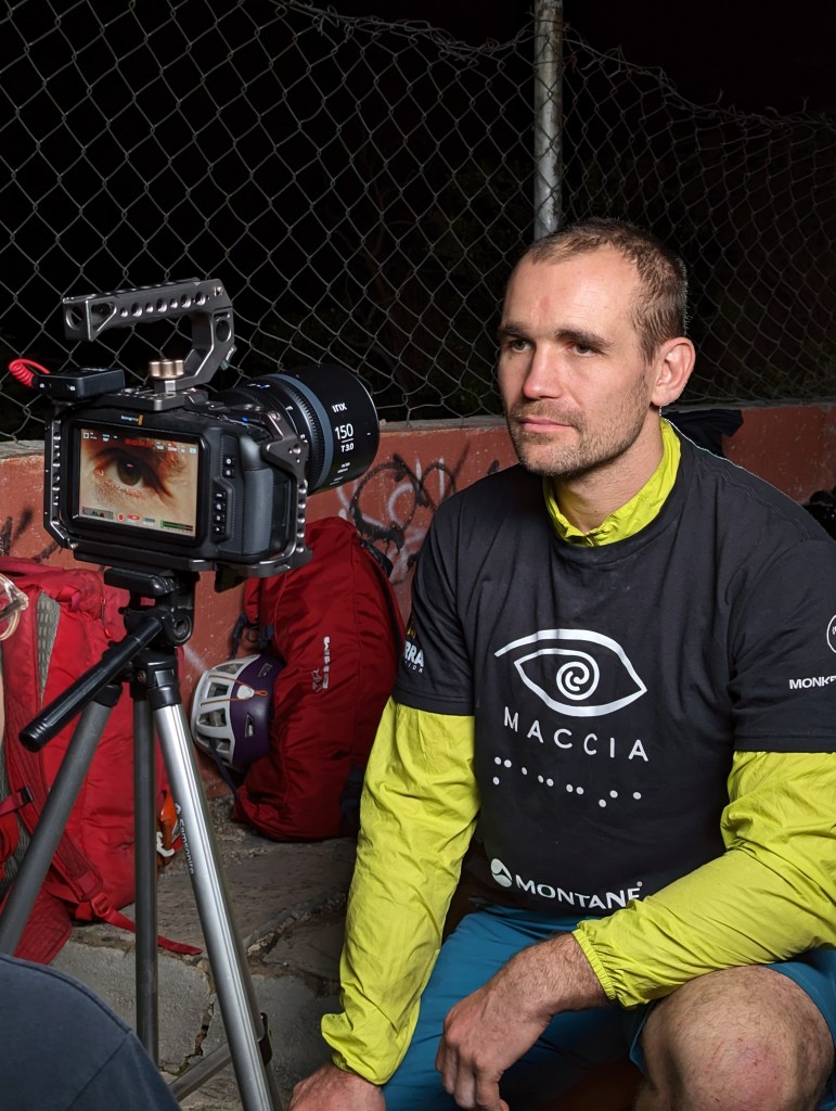 Jesse's eye being the main focus on a camera screen as he is being filmed for an interview
