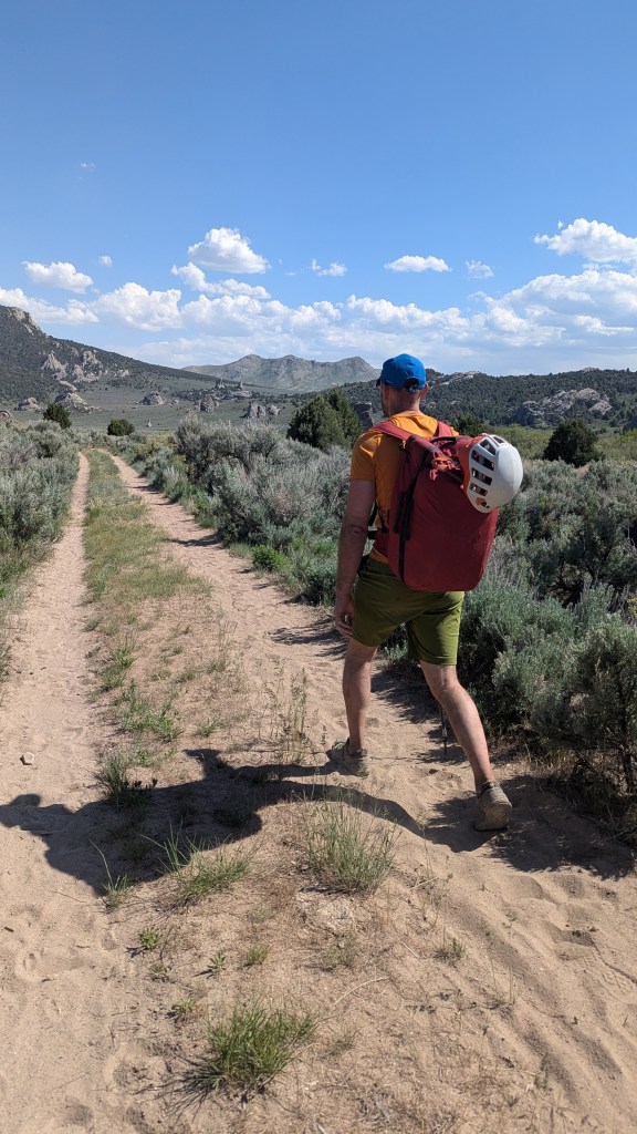 A photo of Jesse walking along the sandy tracks near to the rattlesnake encounter.
